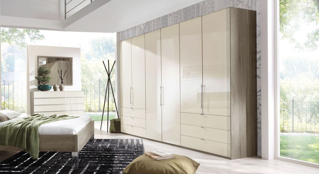 Falttüren-Kleiderschrank Tiko Eiche Dekor mit Glasfront und Schubladen